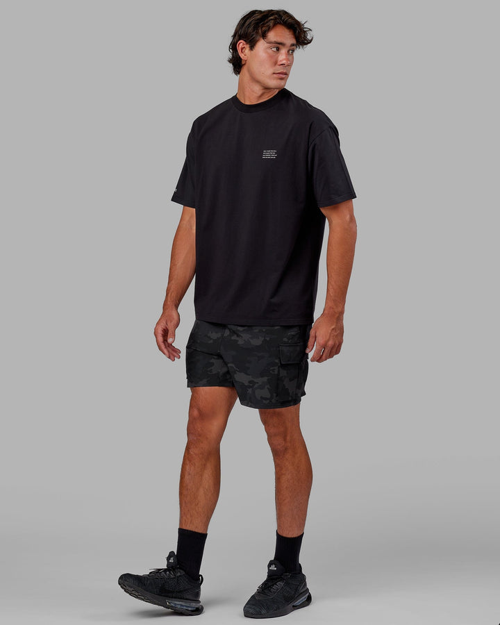 Man wearing Unisex Strive FLXCotton Tee Oversize - Black-White