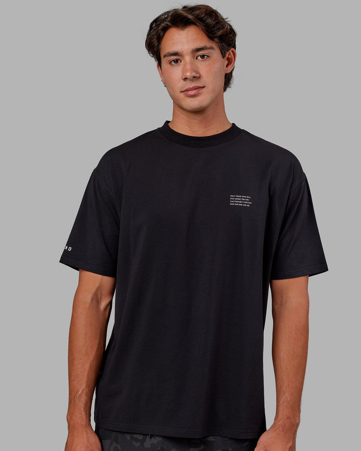 Man wearing Unisex Strive FLXCotton Tee Oversize - Black-White