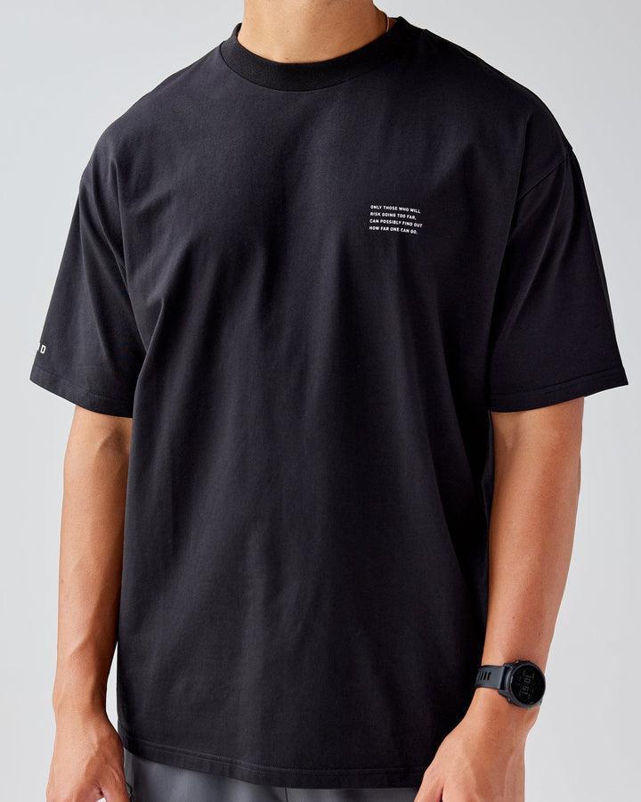 Man wearing Unisex Strive FLXCotton Tee Oversize - Black-White