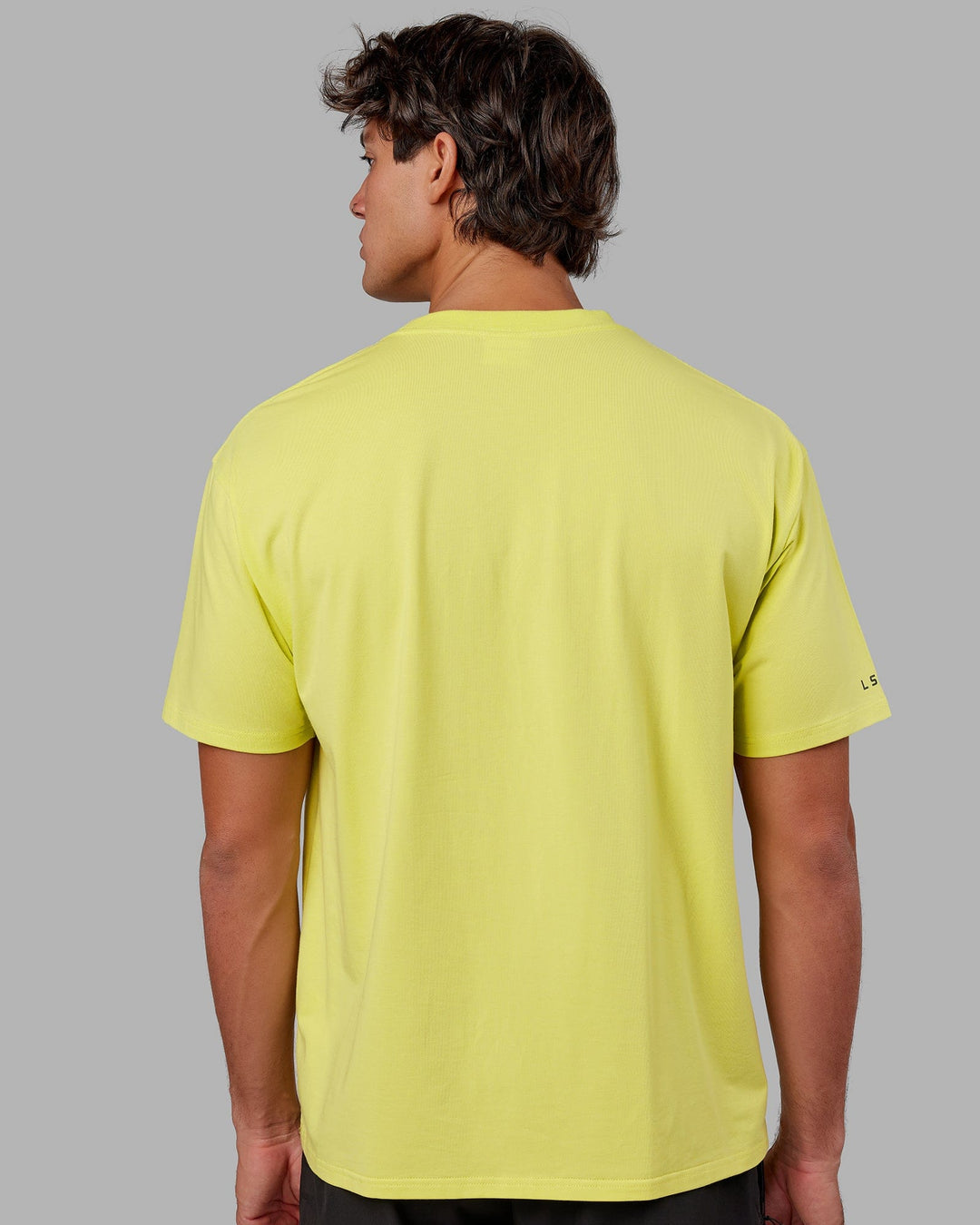 Man wearing Unisex Strive FLXCotton Tee Oversize - Citrus Green