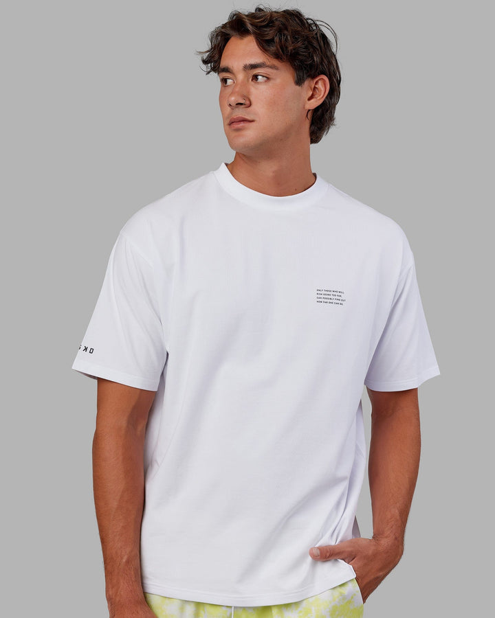 Man wearing Unisex Strive FLXCotton Tee Oversize - White