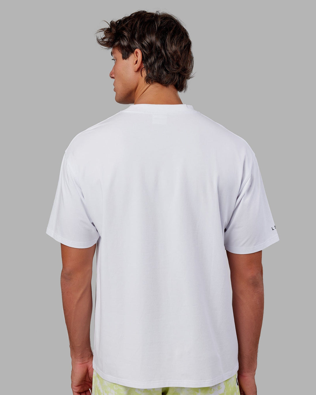 Man wearing Unisex Strive FLXCotton Tee Oversize - White