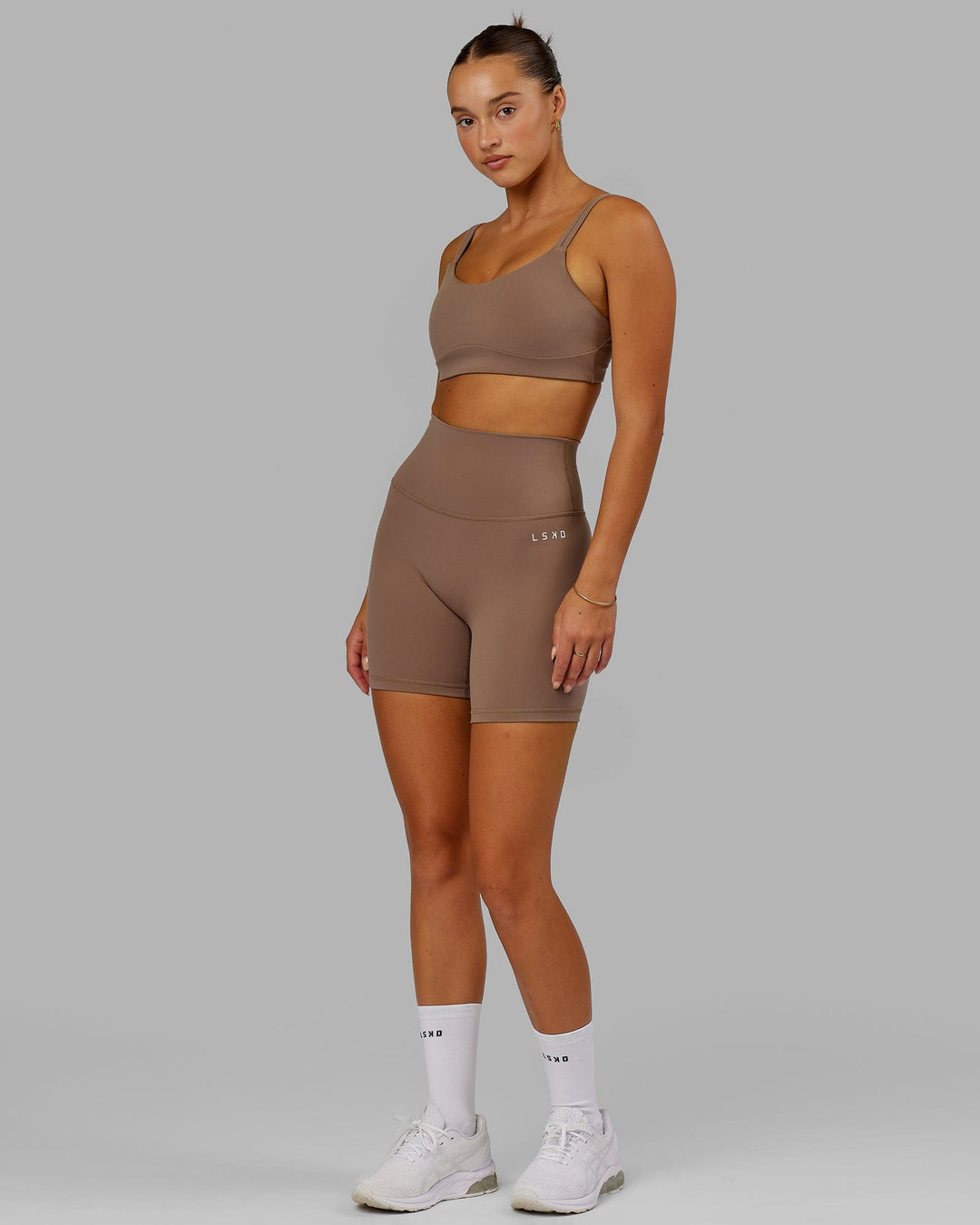 Woman wearing Structure Sports Bra - Deep Taupe