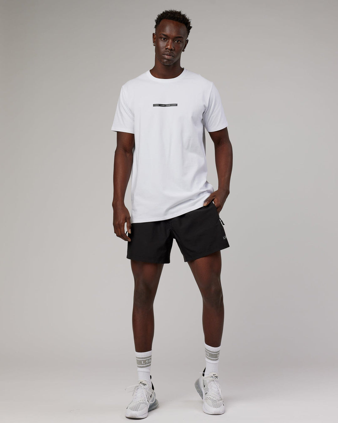 Man wearing Tape FLXCotton Tee Oversize - White