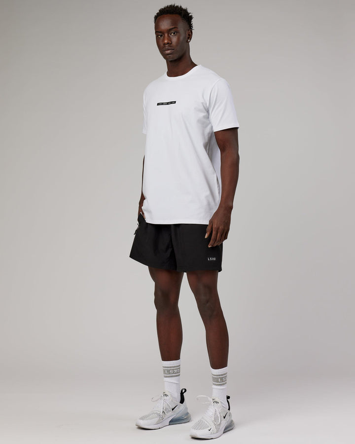 Man wearing Tape FLXCotton Tee Oversize - White