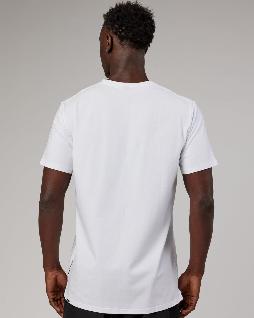 Man wearing Tape FLXCotton Tee Oversize - White