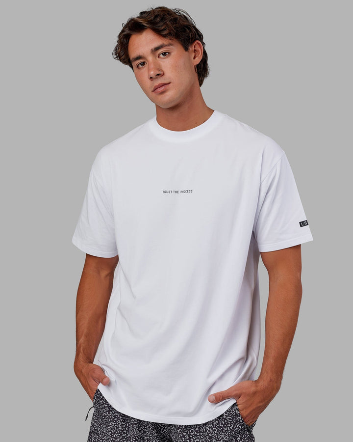 Man wearing Trust The Process FLXCotton Tee Longline Oversize - White