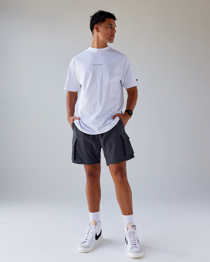 Man wearing Trust The Process FLXCotton Tee Longline Oversize - White