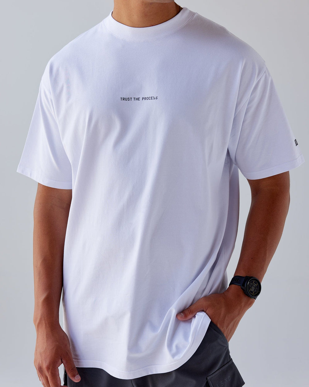 Man wearing Trust The Process FLXCotton Tee Longline Oversize - White