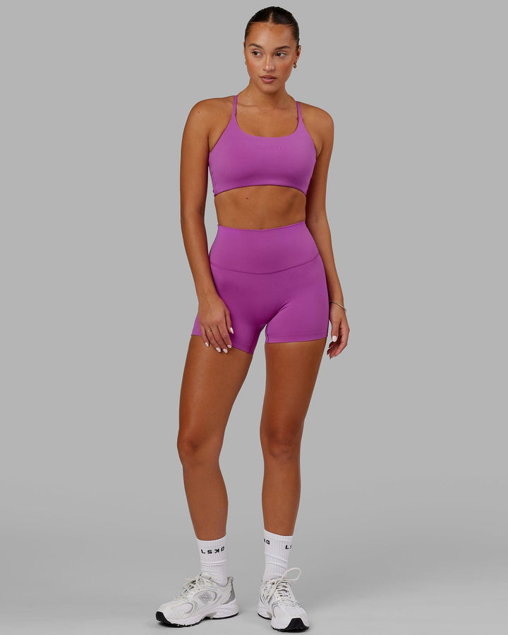 Woman wearing Twist Sports Bra - Orchid