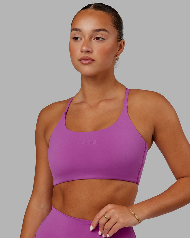 Woman wearing Twist Sports Bra - Orchid