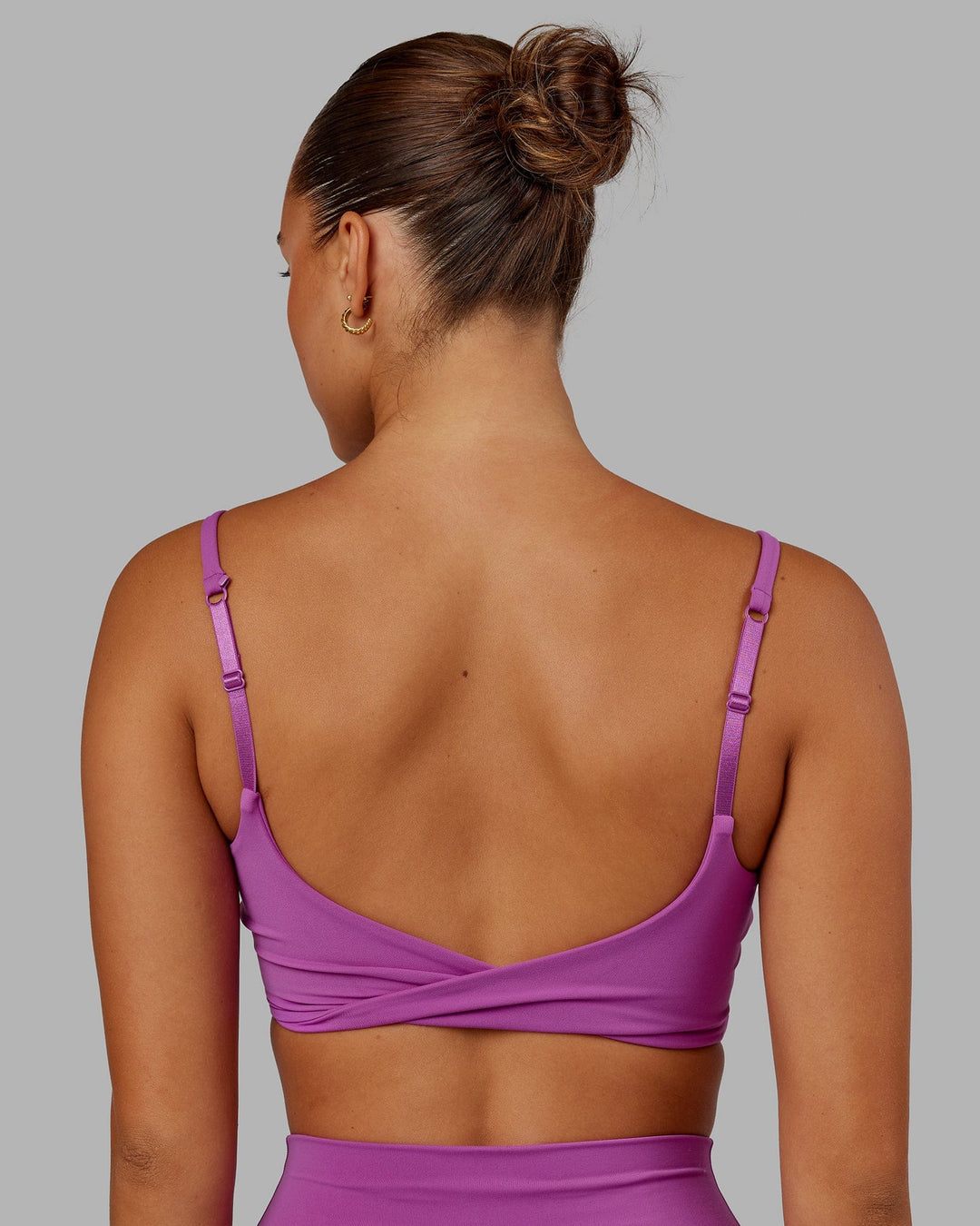 Woman wearing Twist Sports Bra - Orchid