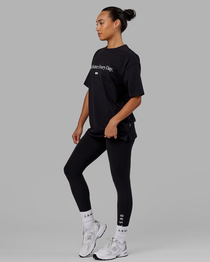 Woman wearing Unisex 1% Better FLXCotton Tee Oversize - Black