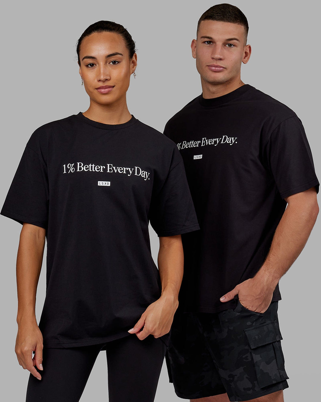 Man and Woman wearing Unisex 1% Better FLXCotton Tee Oversize - Black