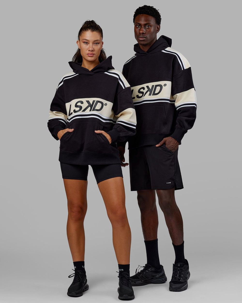 Man and Woman wearing Unisex A-Team Hoodie Oversize - Black-Bone