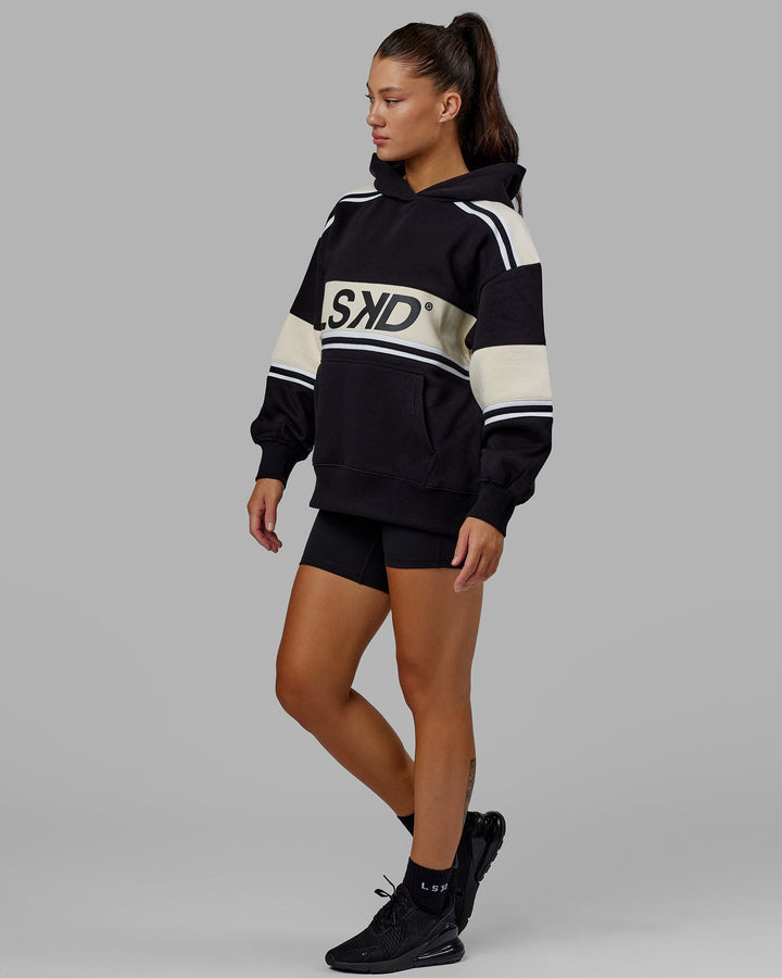 Woman wearing Unisex A-Team Hoodie Oversize - Black-Bone