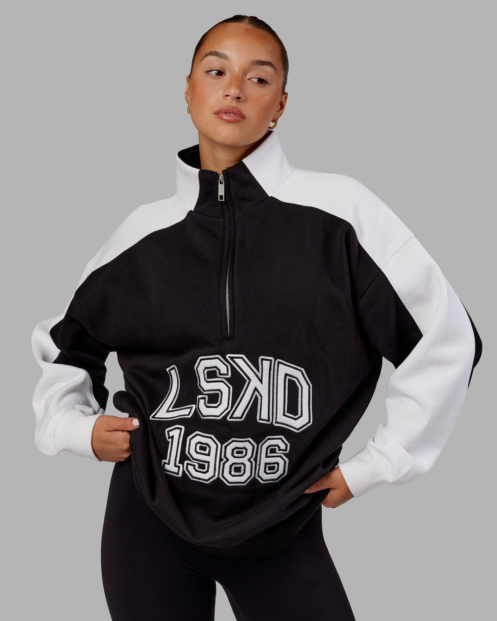 Black sweater shop with white zipper