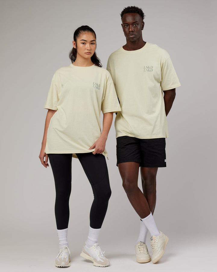 Woman wearingnUnisex Aurora Oversize Tee - Almond Milk