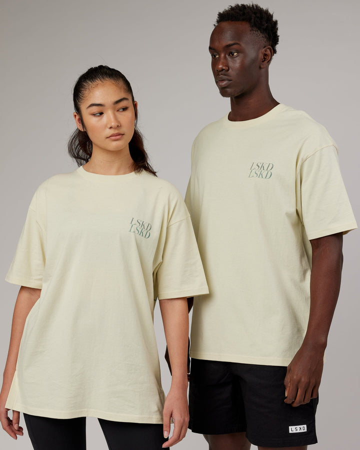 Woman wearingnUnisex Aurora Oversize Tee - Almond Milk