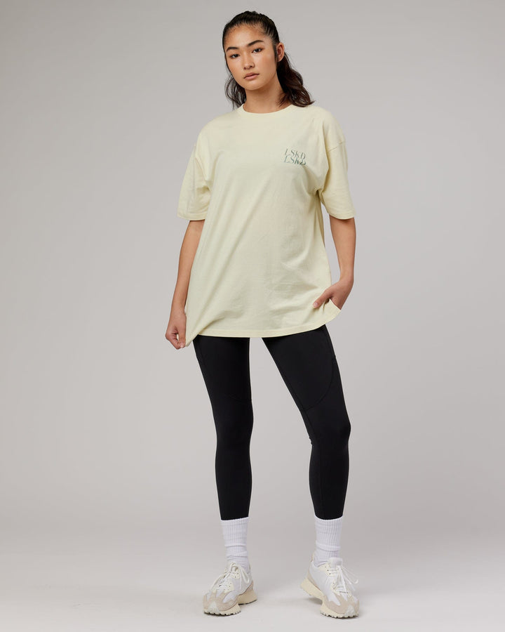 Woman wearingnUnisex Aurora Oversize Tee - Almond Milk