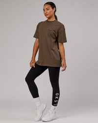  Woman wearing Unisex Capsule FLXCotton Tee Oversize - Army Green