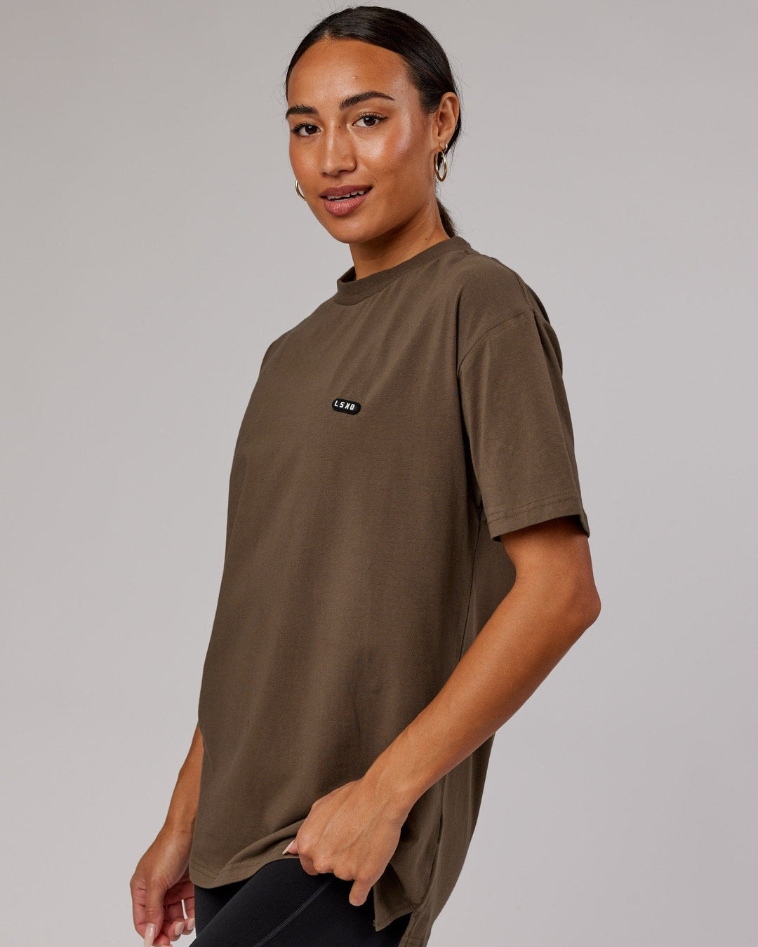 Woman wearing Unisex Capsule FLXCotton Tee Oversize - Army Green