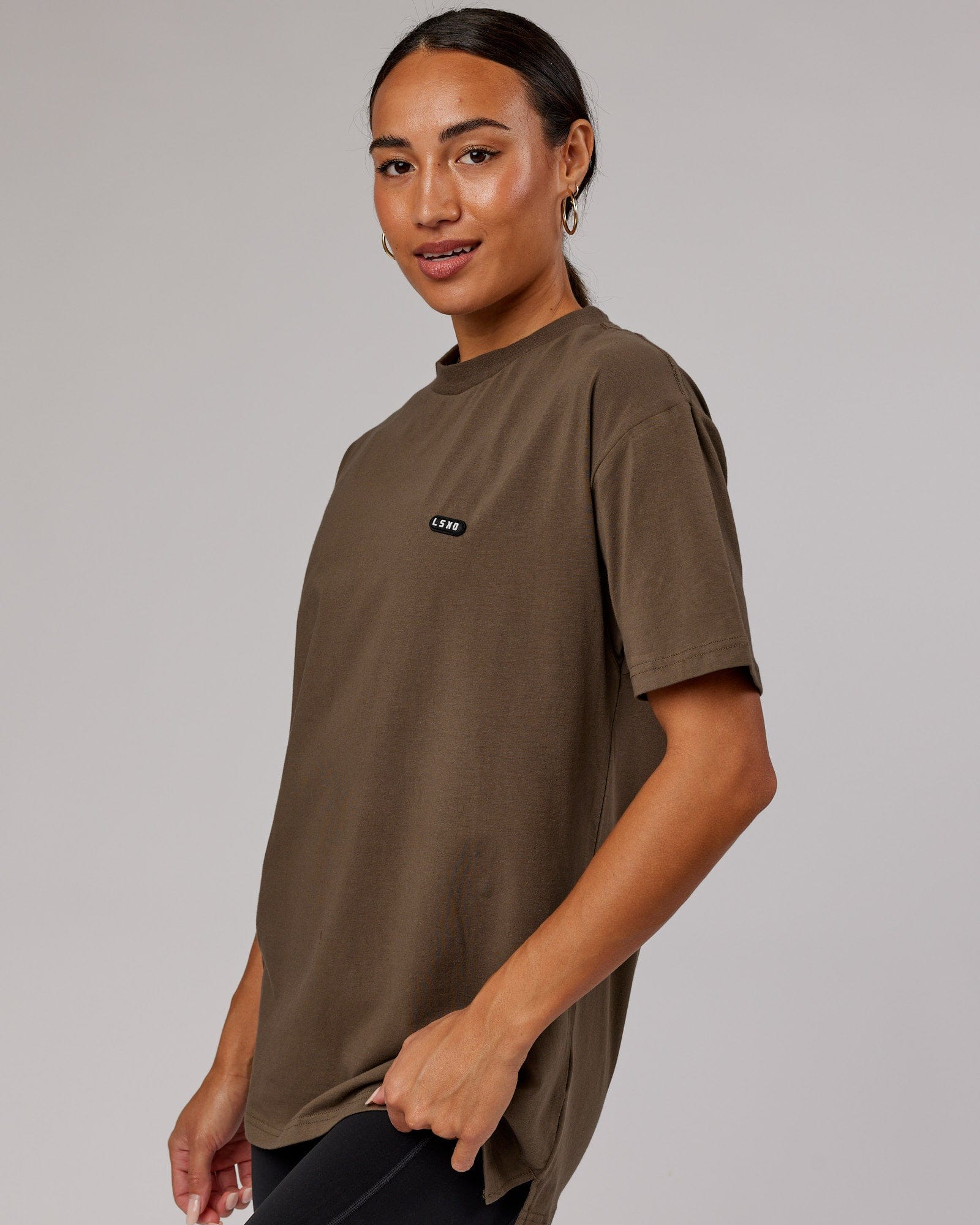 Woman wearing Unisex Capsule FLXCotton Tee Oversize - Army Green