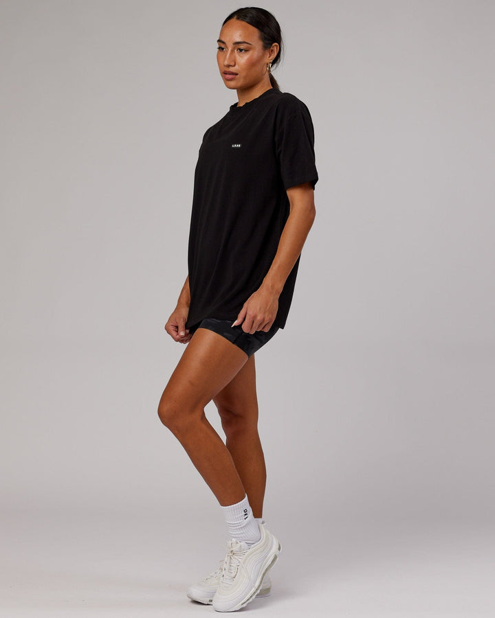 Woman wearing Unisex Capsule FLXCotton Tee Oversize - Black