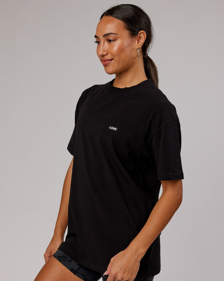 Woman wearing Unisex Capsule FLXCotton Tee Oversize - Black