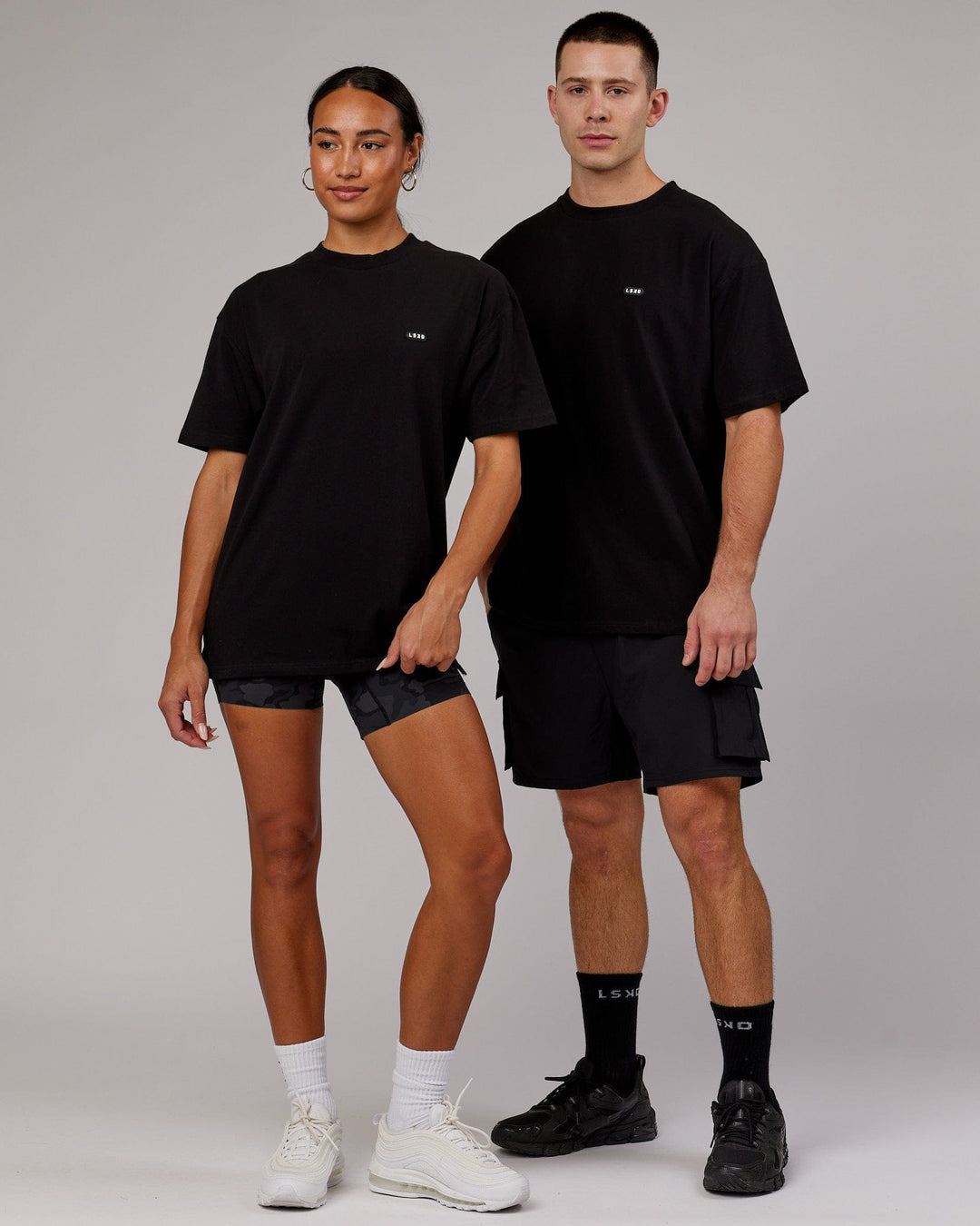 Man and Woman wearing Unisex Capsule FLXCotton Tee Oversize - Black