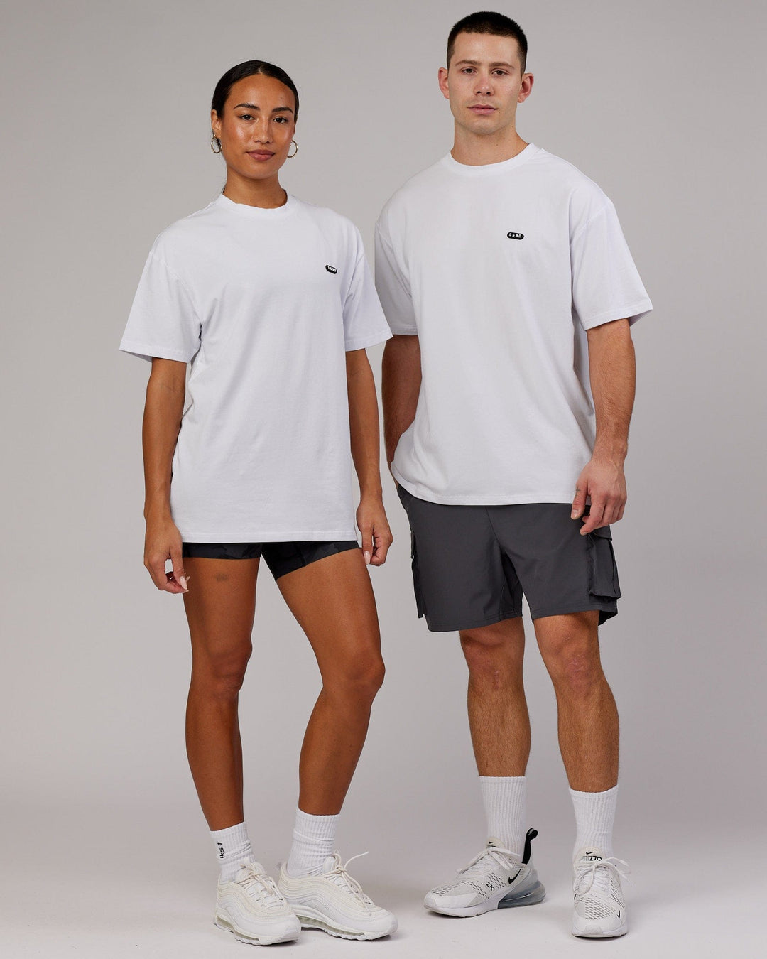 Man and Woman wearing Unisex Capsule FLXCotton Tee Oversize - White