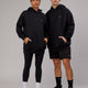 Woman wearing Unisex Capsule Hoodie Oversize - Black