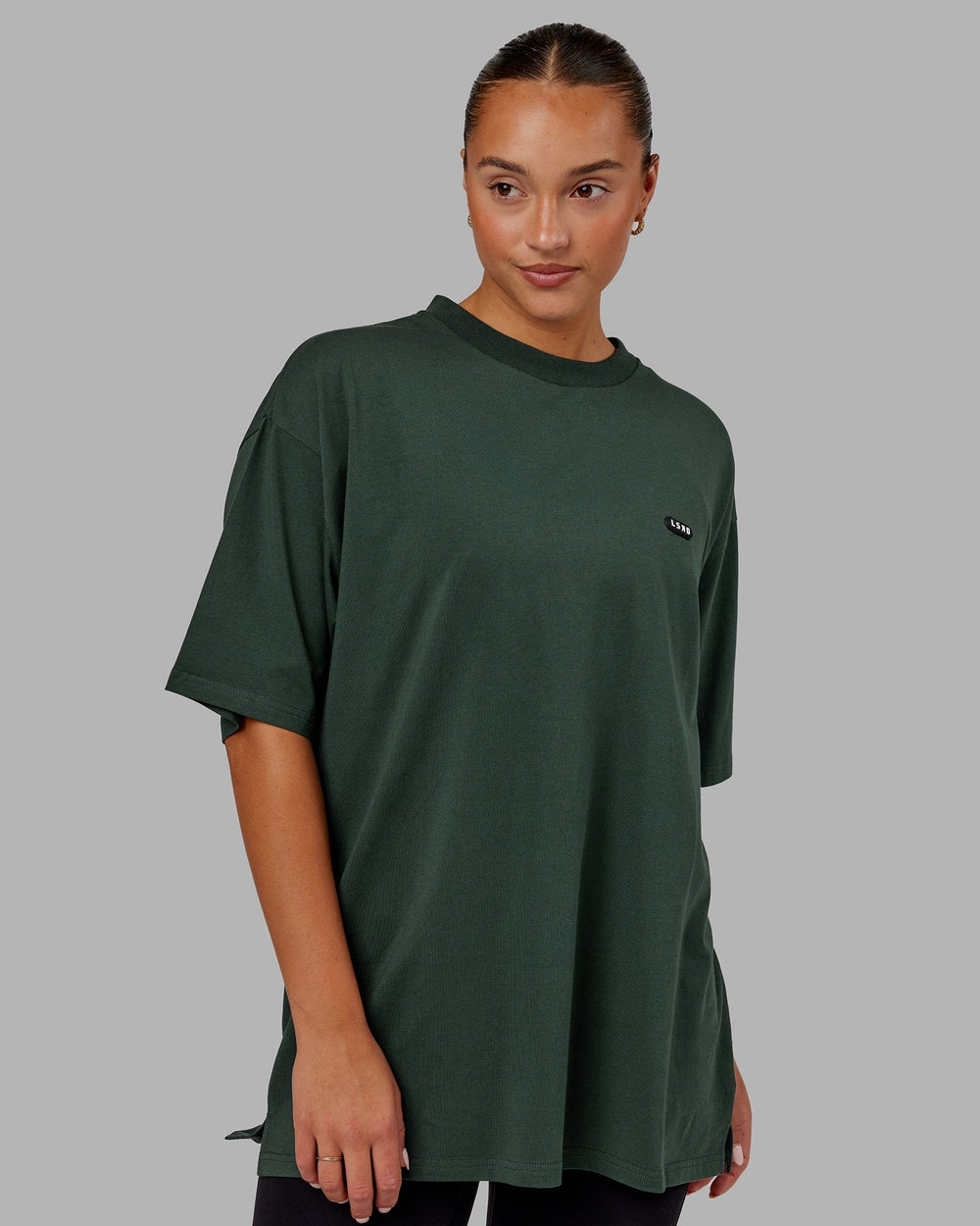 Woman wearing Unisex Capsule FLXCotton Tee Oversize - Vital Green