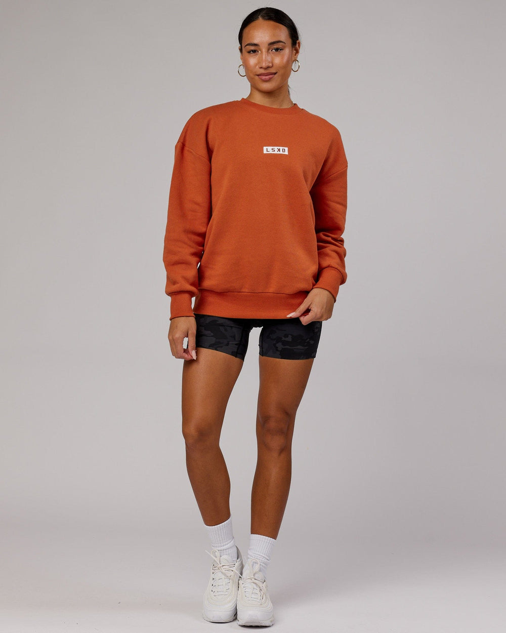 Woman wearing Unisex Cornerstone Sweater Oversize - Auburn