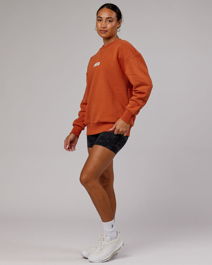 Woman wearing Unisex Cornerstone Sweater Oversize - Auburn