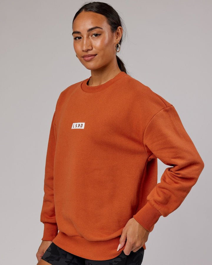 Woman wearing Unisex Cornerstone Sweater Oversize - Auburn