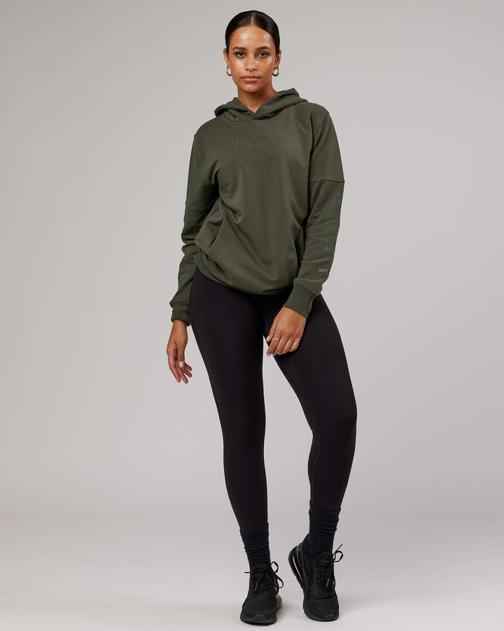 Woman wearing Unisex Direction FLXFleece Hoodie - Forest Night