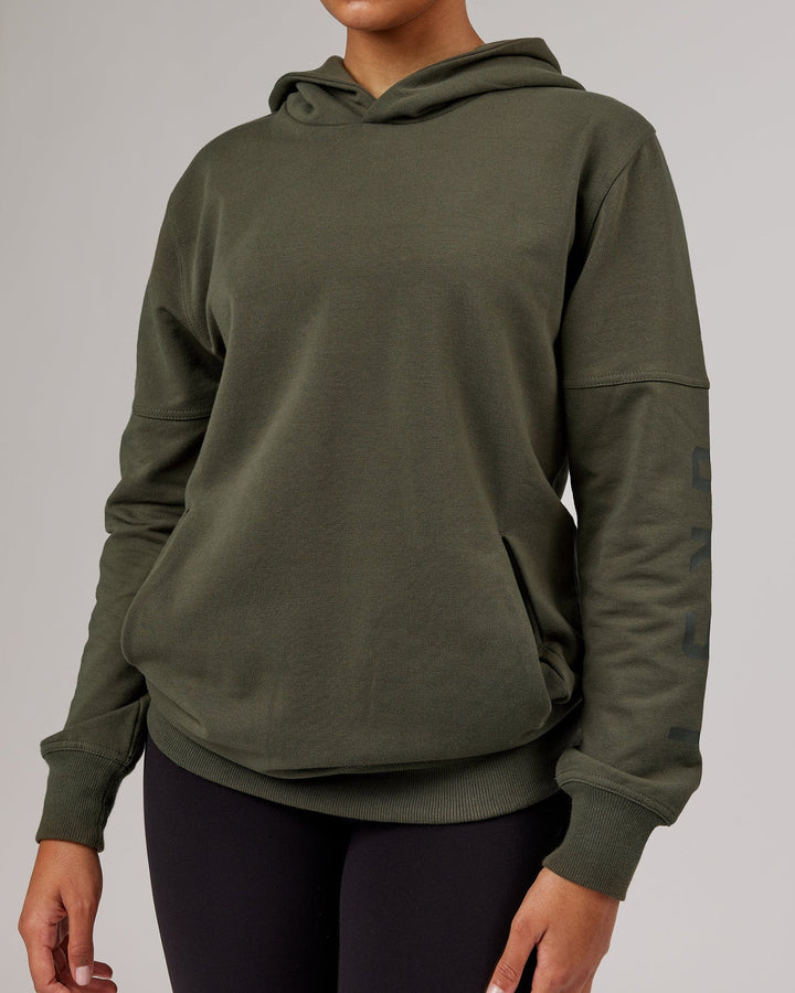 Woman wearing Unisex Direction FLXFleece Hoodie - Forest Night