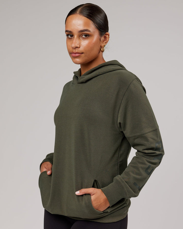 Woman wearing Unisex Direction FLXFleece Hoodie - Forest Night