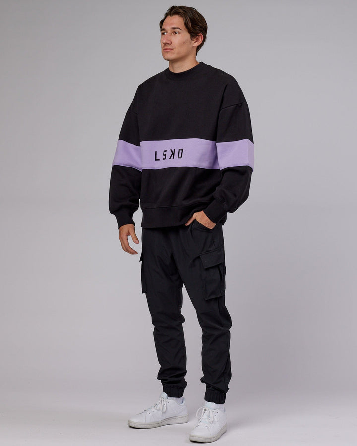 Man wearing Unisex Extra Time Sweater Oversize - Black-Pale Lilac