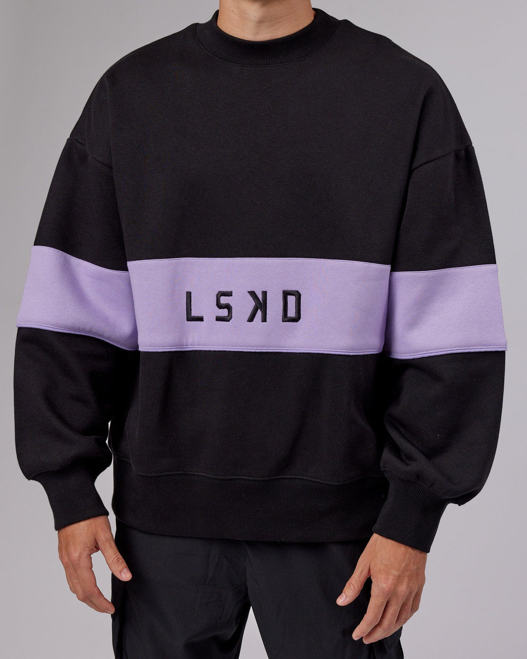 Man wearing Unisex Extra Time Sweater Oversize - Black-Pale Lilac