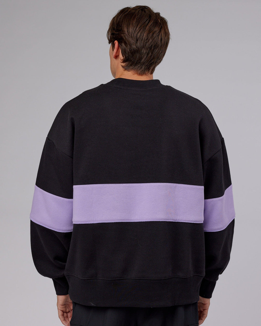 Man wearing Unisex Extra Time Sweater Oversize - Black-Pale Lilac