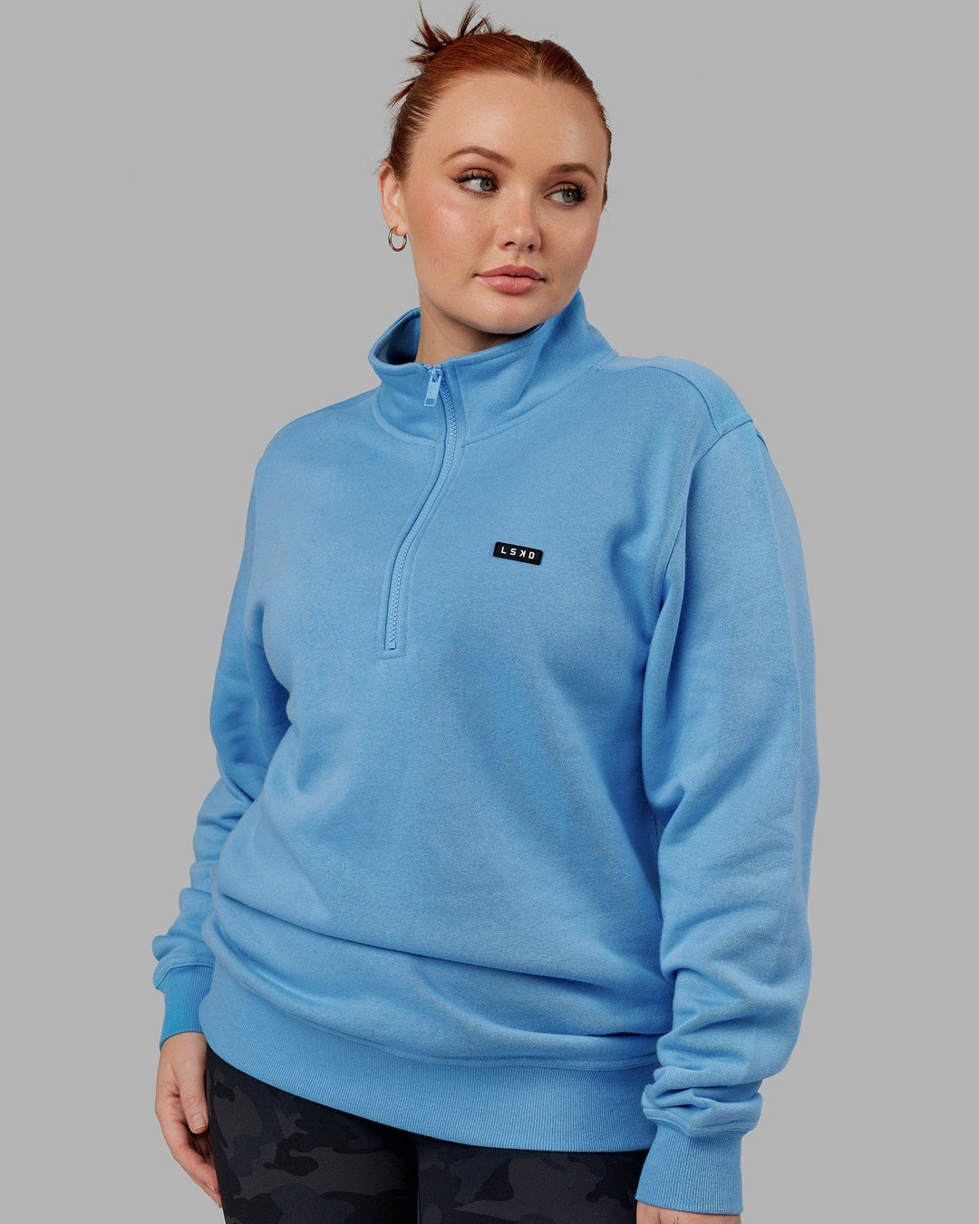 Woman wearing Unisex Fundamental 1/4 Zip Sweater - Azure Blue