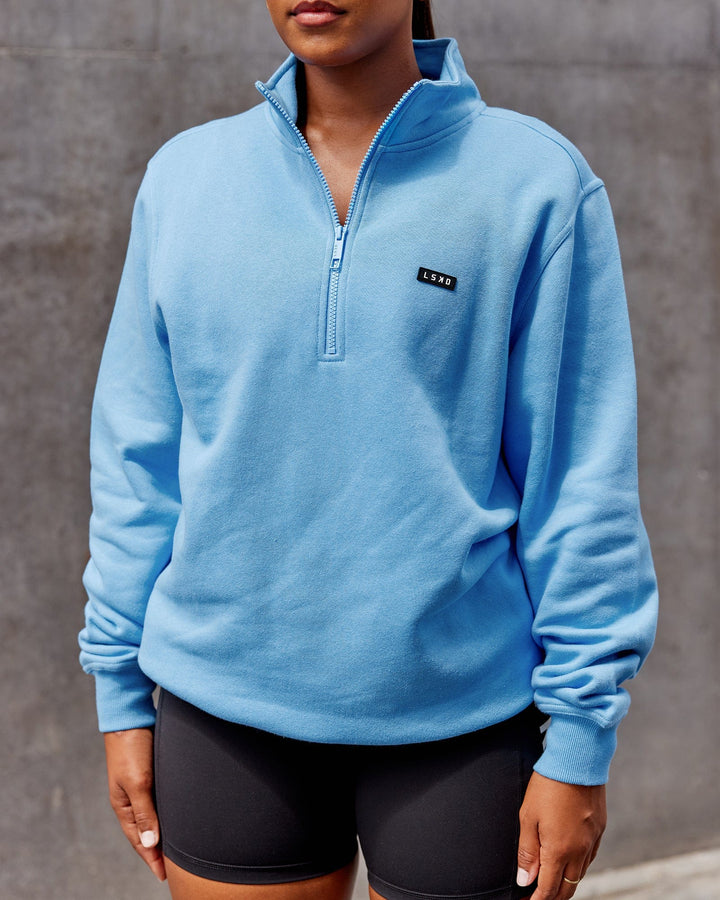 Woman wearing Unisex Fundamental 1/4 Zip Sweater - Azure Blue