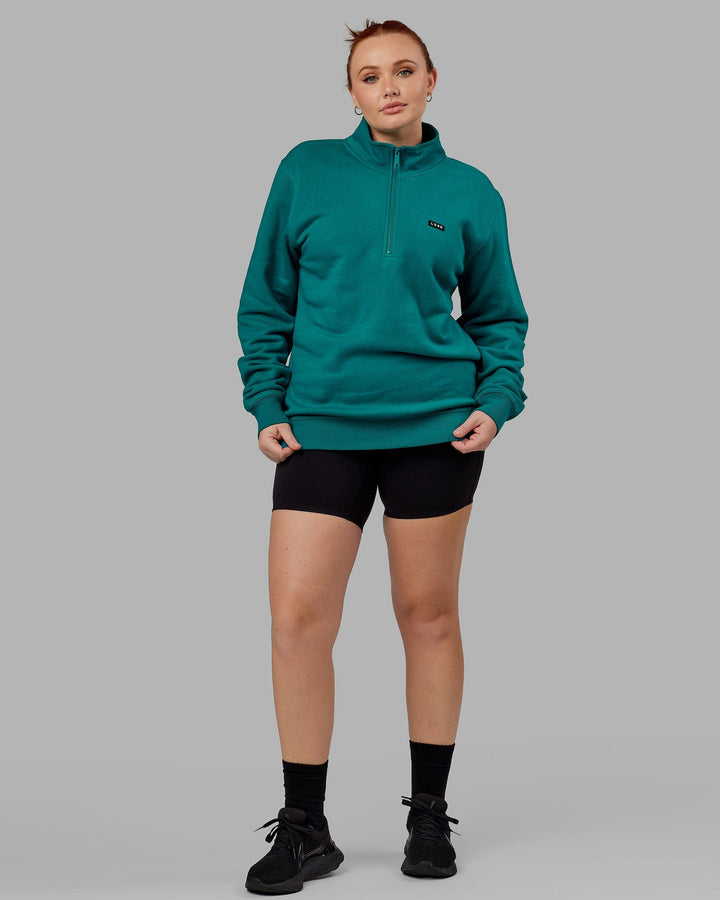 Woman wearing Unisex Fundamental 1/4 Zip Sweater - Deep Lake