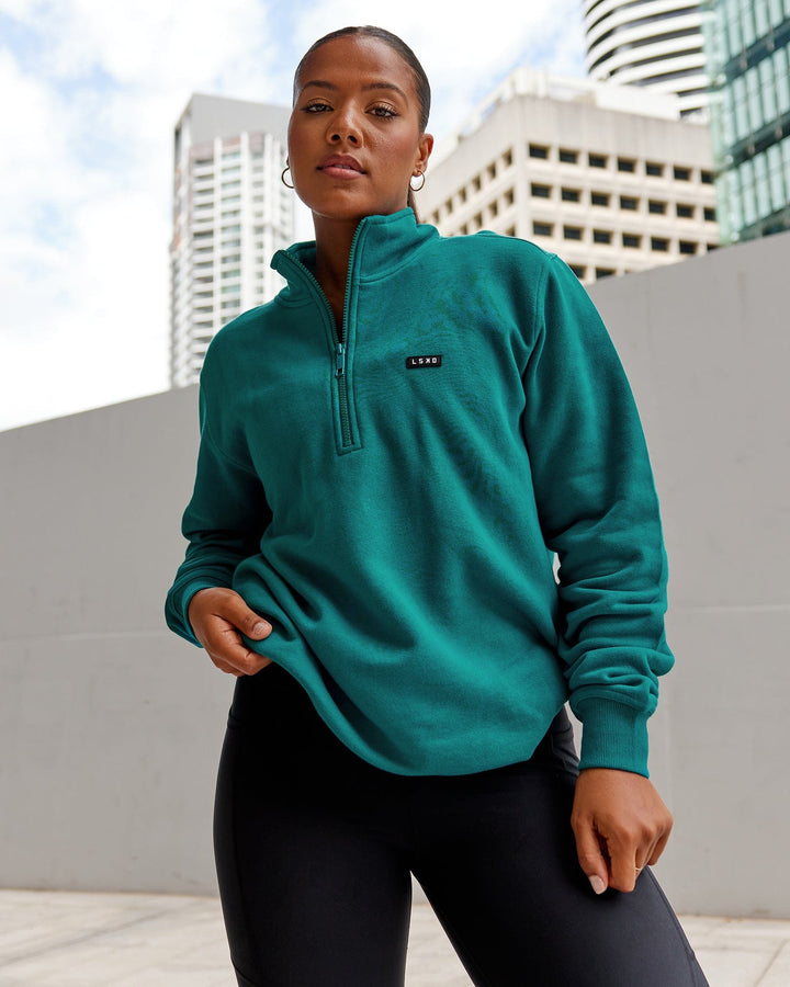 Woman wearing Unisex Fundamental 1/4 Zip Sweater - Deep Lake