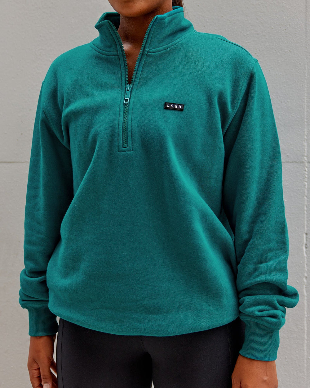 Woman wearing Unisex Fundamental 1/4 Zip Sweater - Deep Lake