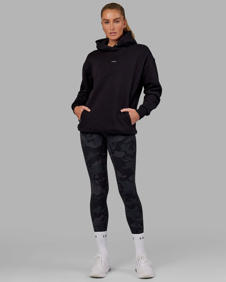 Woman wearing Unisex Fundamental Hoodie Oversize - Black