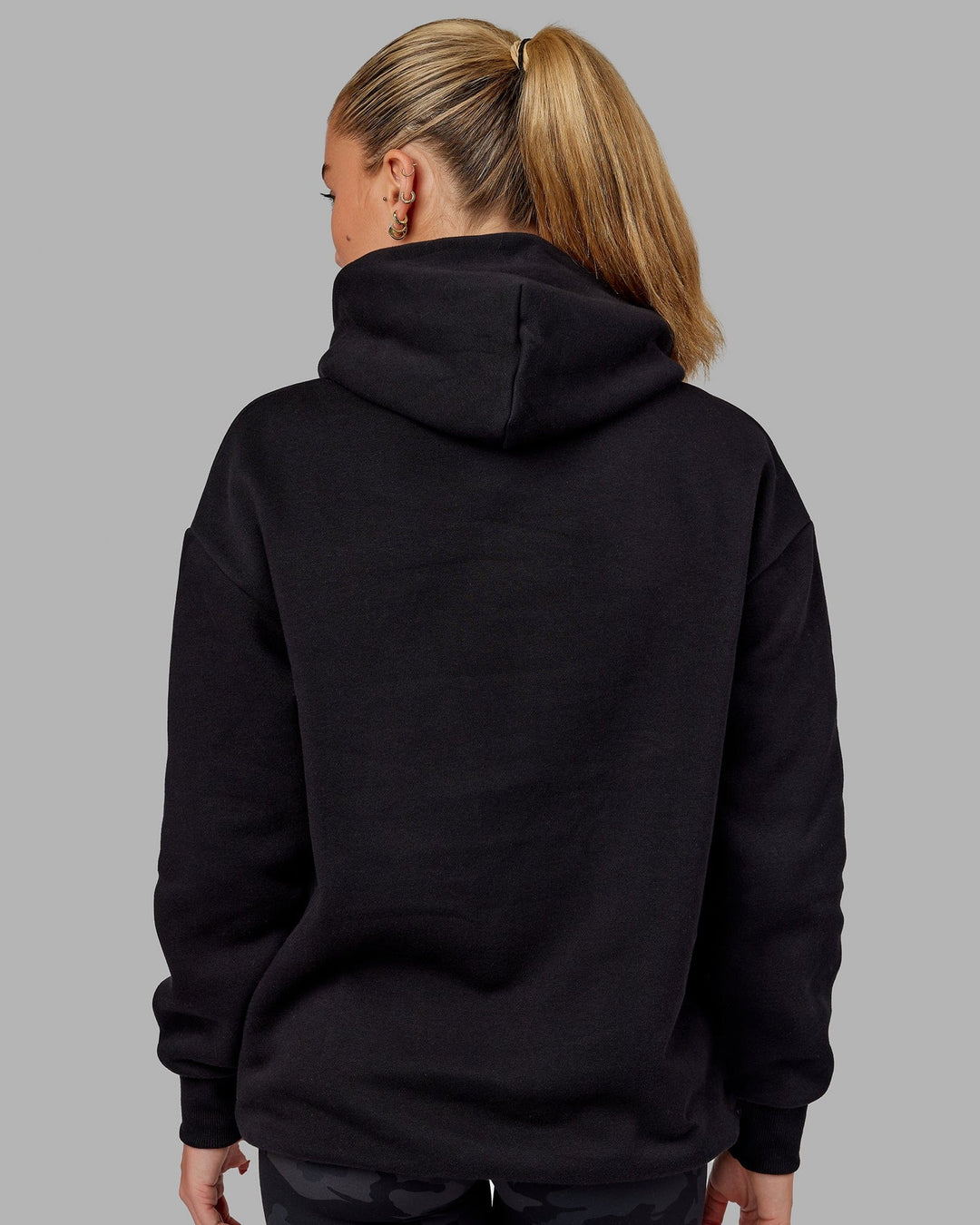 Woman wearing Unisex Fundamental Hoodie Oversize - Black