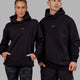 Woman wearing Unisex Fundamental Hoodie Oversize - Black